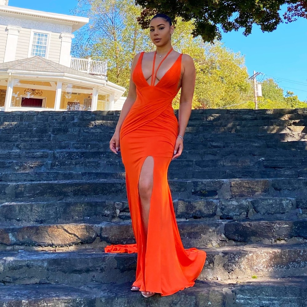 Orange open back slit gown